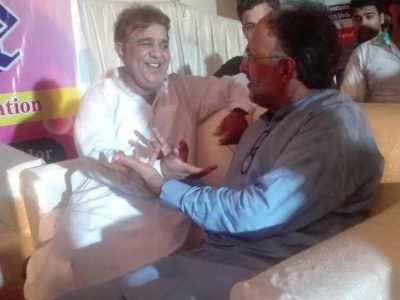 Abid Butt with Qamar Zaman Kaira on a political discussion 2017.